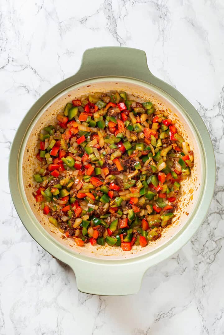 Overhead view of sauteed veggies in skillet