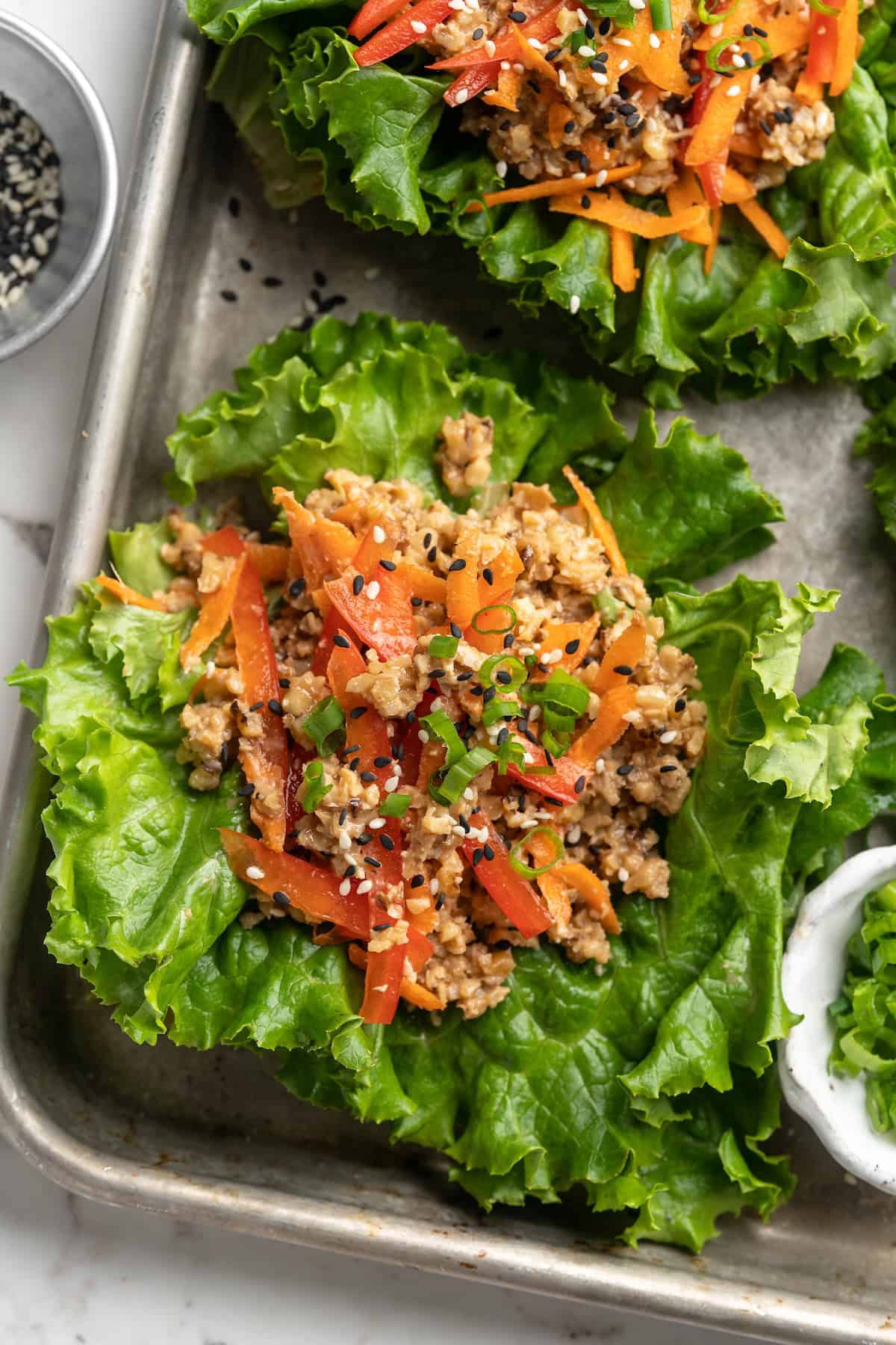 Overhead view of lettuce wraps on sheet pan