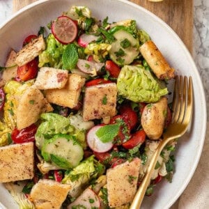 Overhead view of fattoush salad in bowl with fork