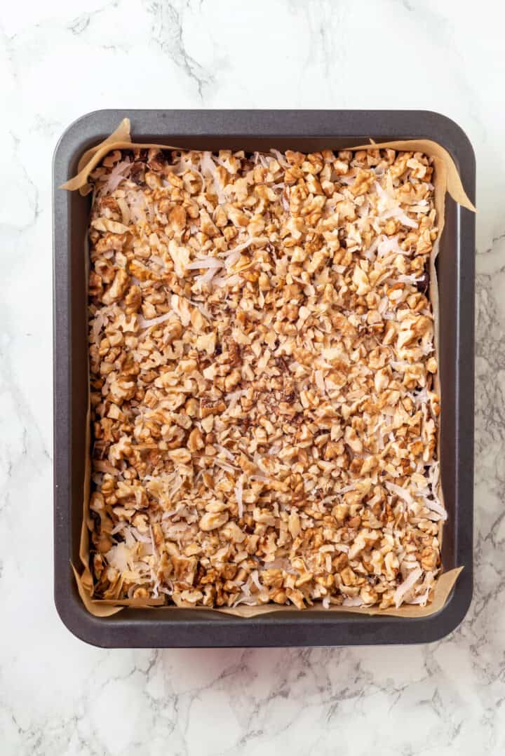 Overhead view of seven layer bars before adding condensed milk