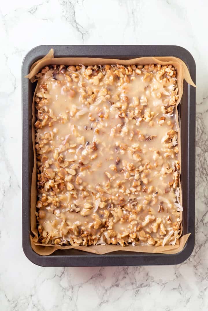 Overhead view of seven layer bars in pan before baking