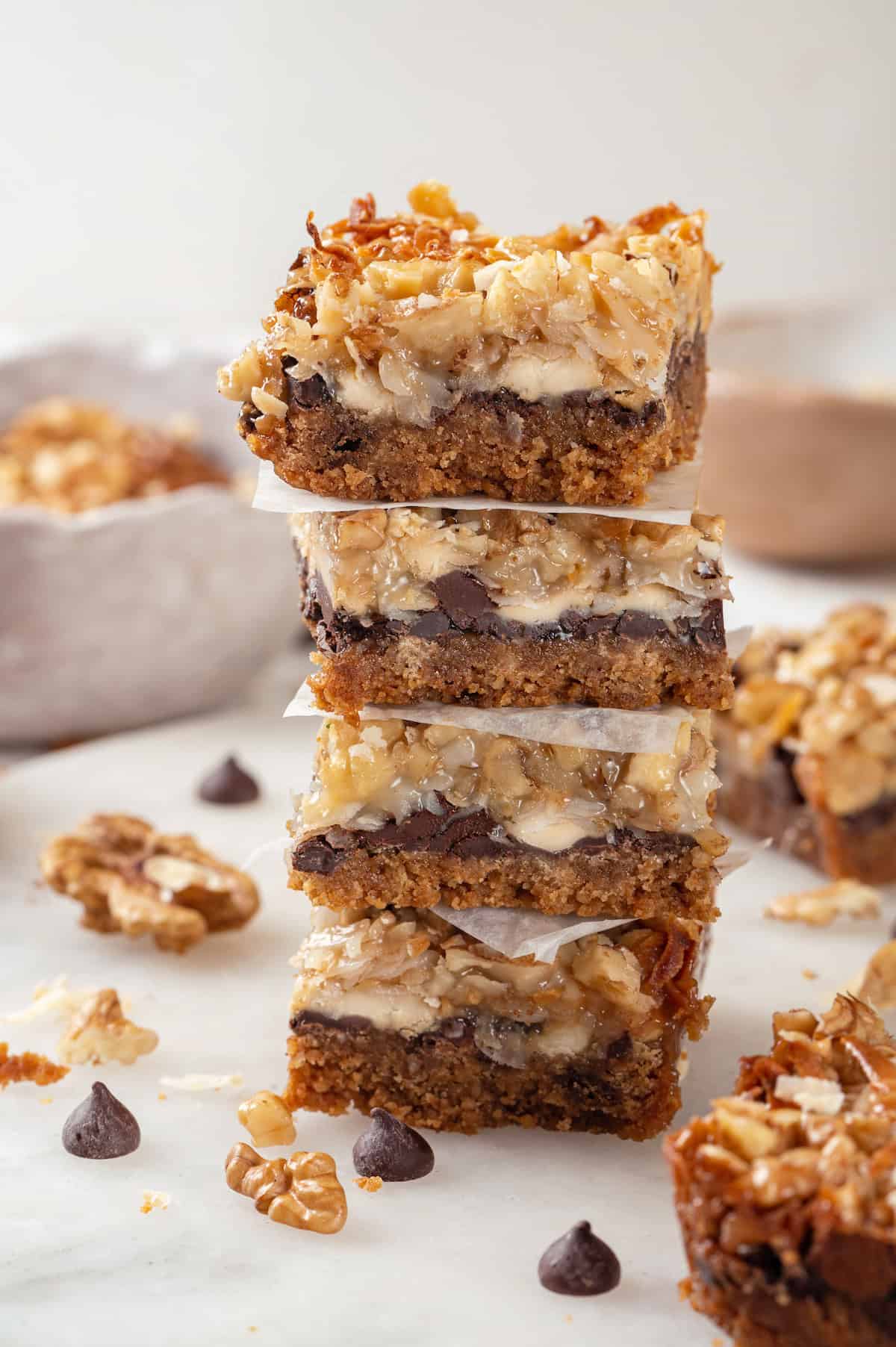 4 stacked seven layer bars with parchment between them