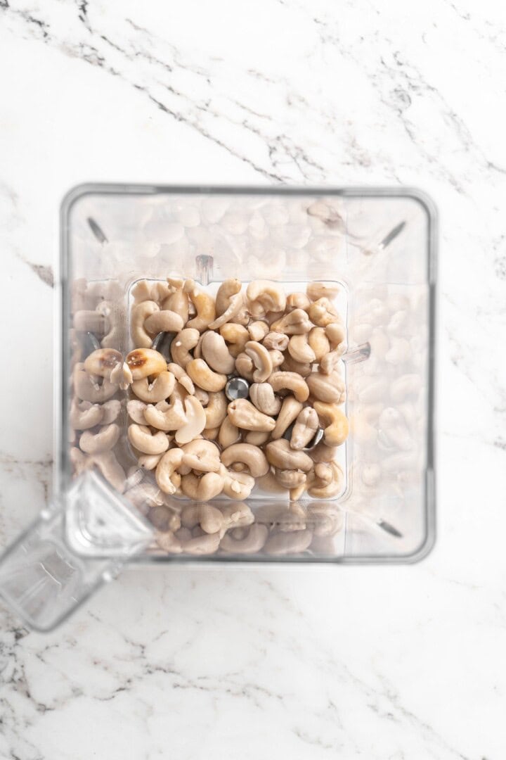 Overhead view of ingredients for cashew sour cream in blender