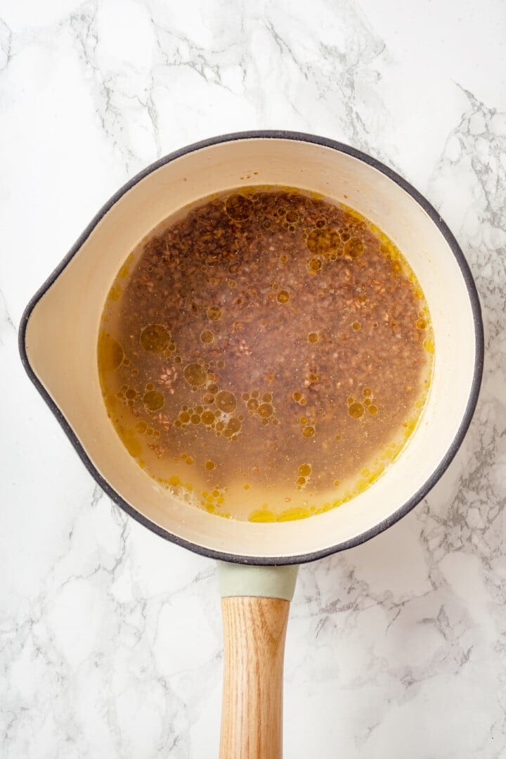 Overhead view of bulgur soaking in saucepan