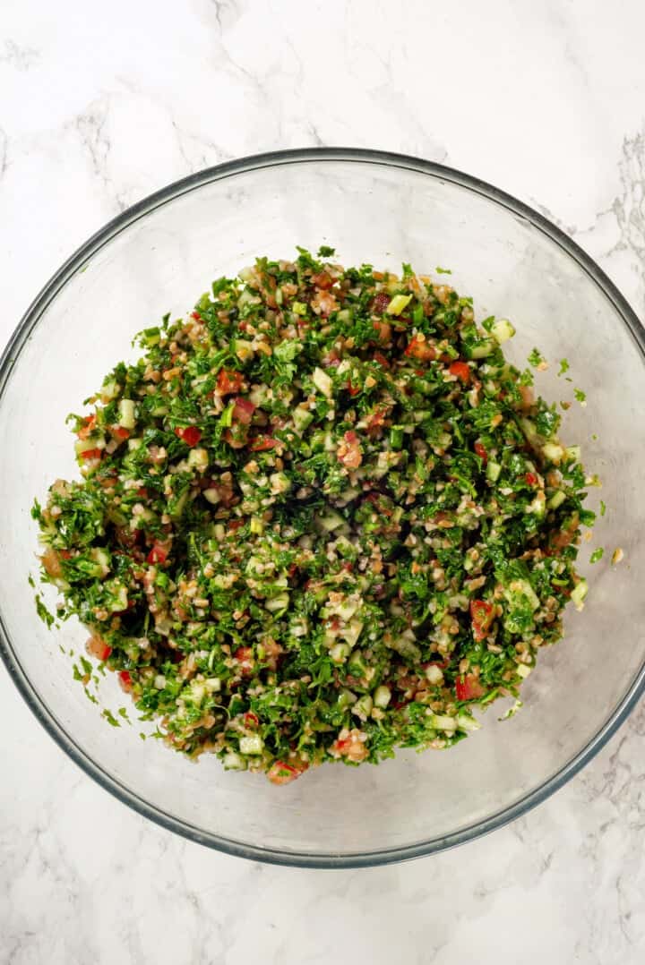 Overhead view of tabbouleh in mixing bowl