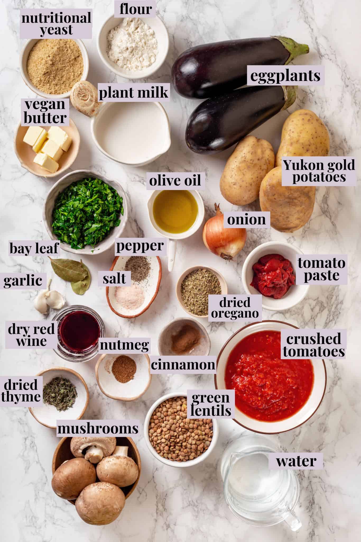 Overhead view of ingredients for vegan moussaka with labels