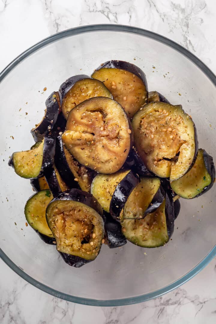 Overhead view of eggplant slices in bowl