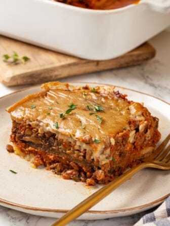 Portion of vegan moussaka on plate with fork