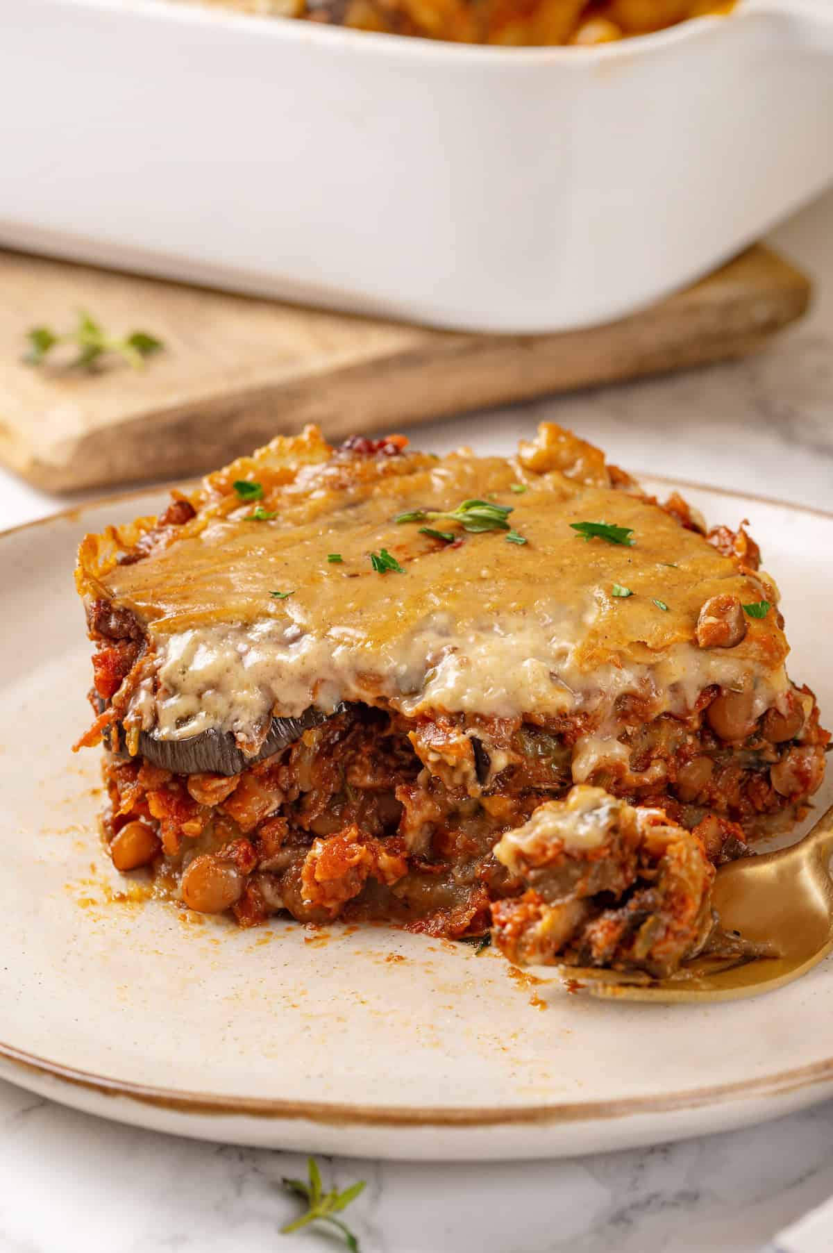 Portion of vegan moussaka with lentils on plate