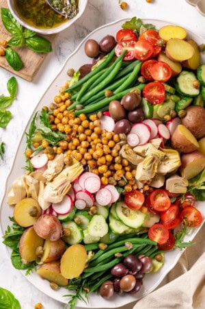 Overhead view of vegan nicoise salad on platter