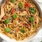 Overhead view of creamy garlic pasta in skillet