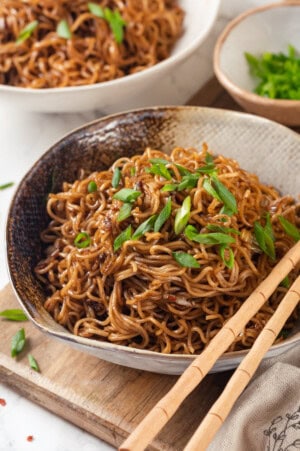 Spicy ramen in bowl garnished with green onions