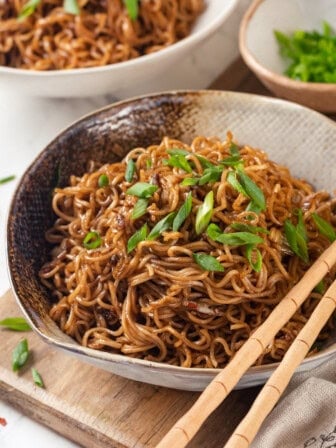 Spicy ramen in bowl garnished with green onions