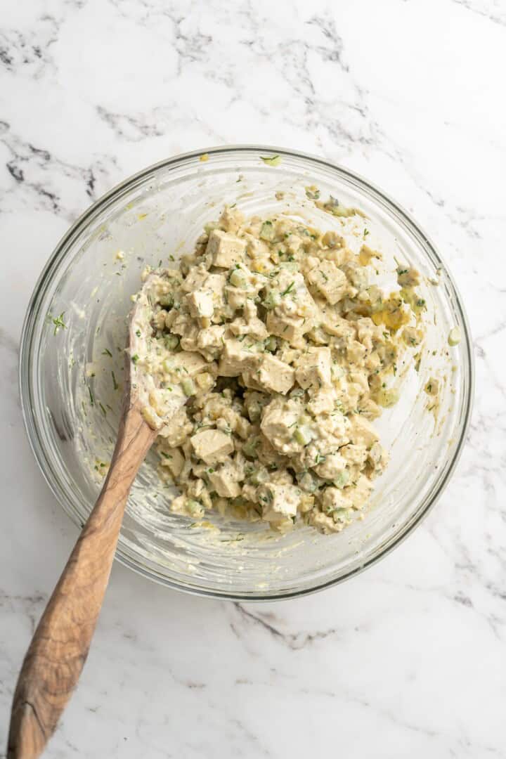 Overhead view of tofu egg salad in mixing bowl