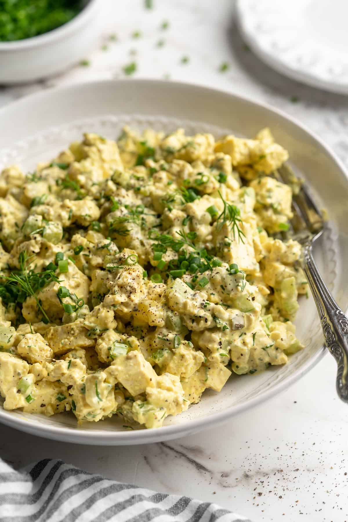 Tofu egg salad in bowl with fork