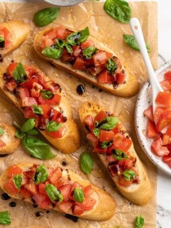 Overhead view of classic bruschetta on parchment paper