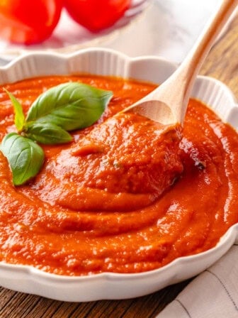 Pomodoro sauce in bowl with wooden spoon