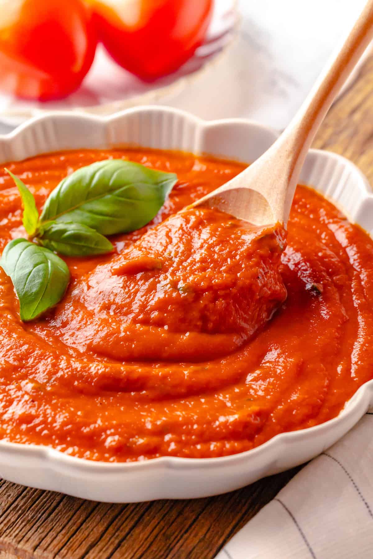 Pomodoro sauce in bowl with wooden spoon