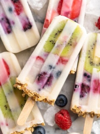 Pile of yogurt popsicles with fruit and granola