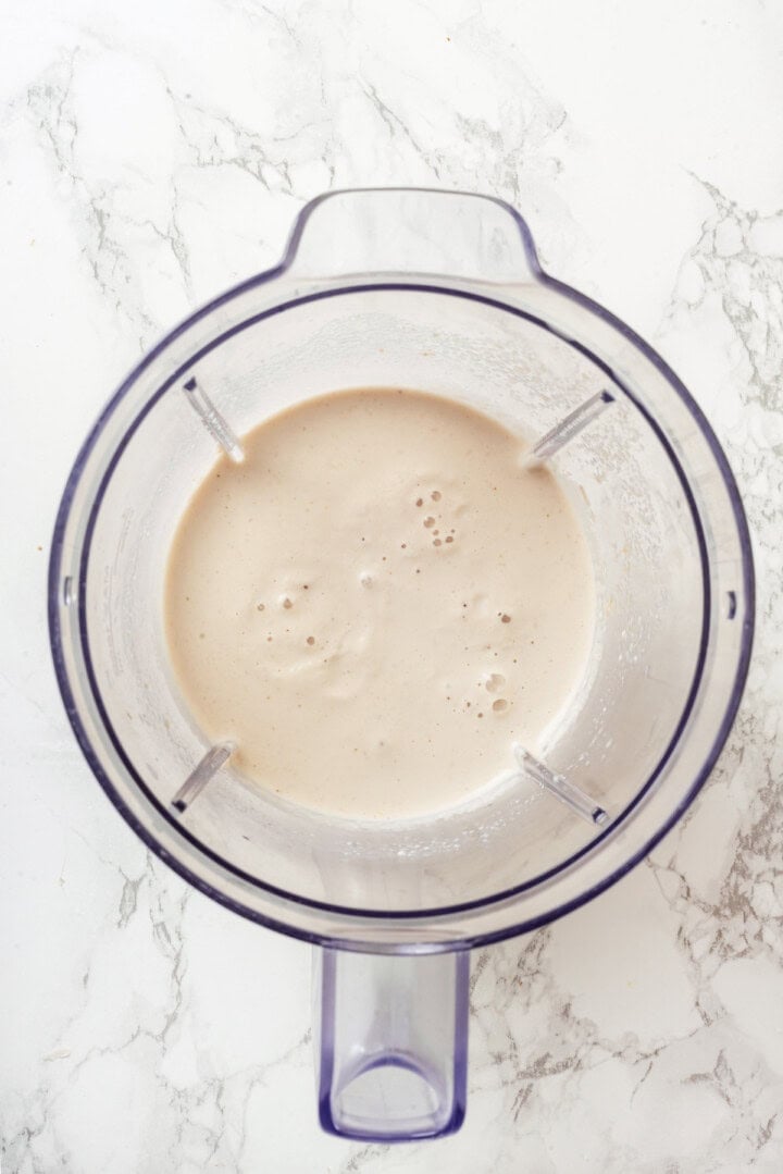 Overhead view of cashew cream in blender