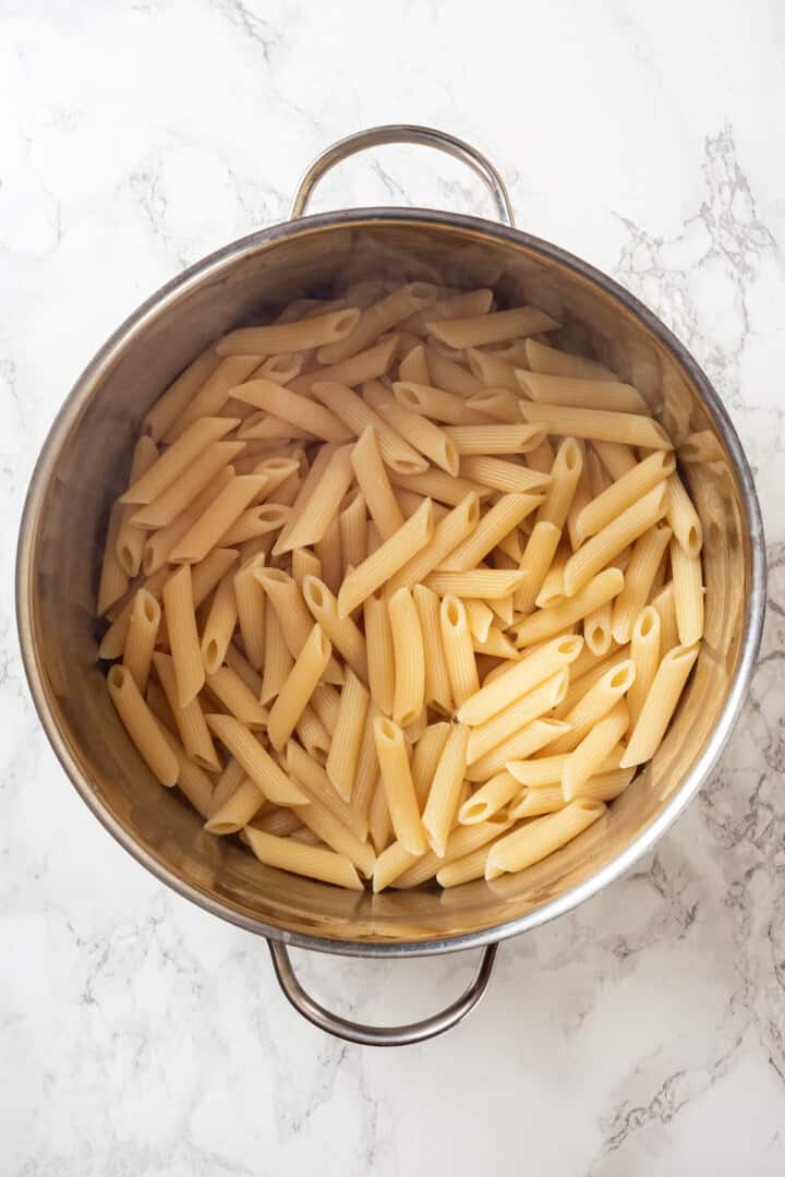 Overhead view of cooked pasta in colander