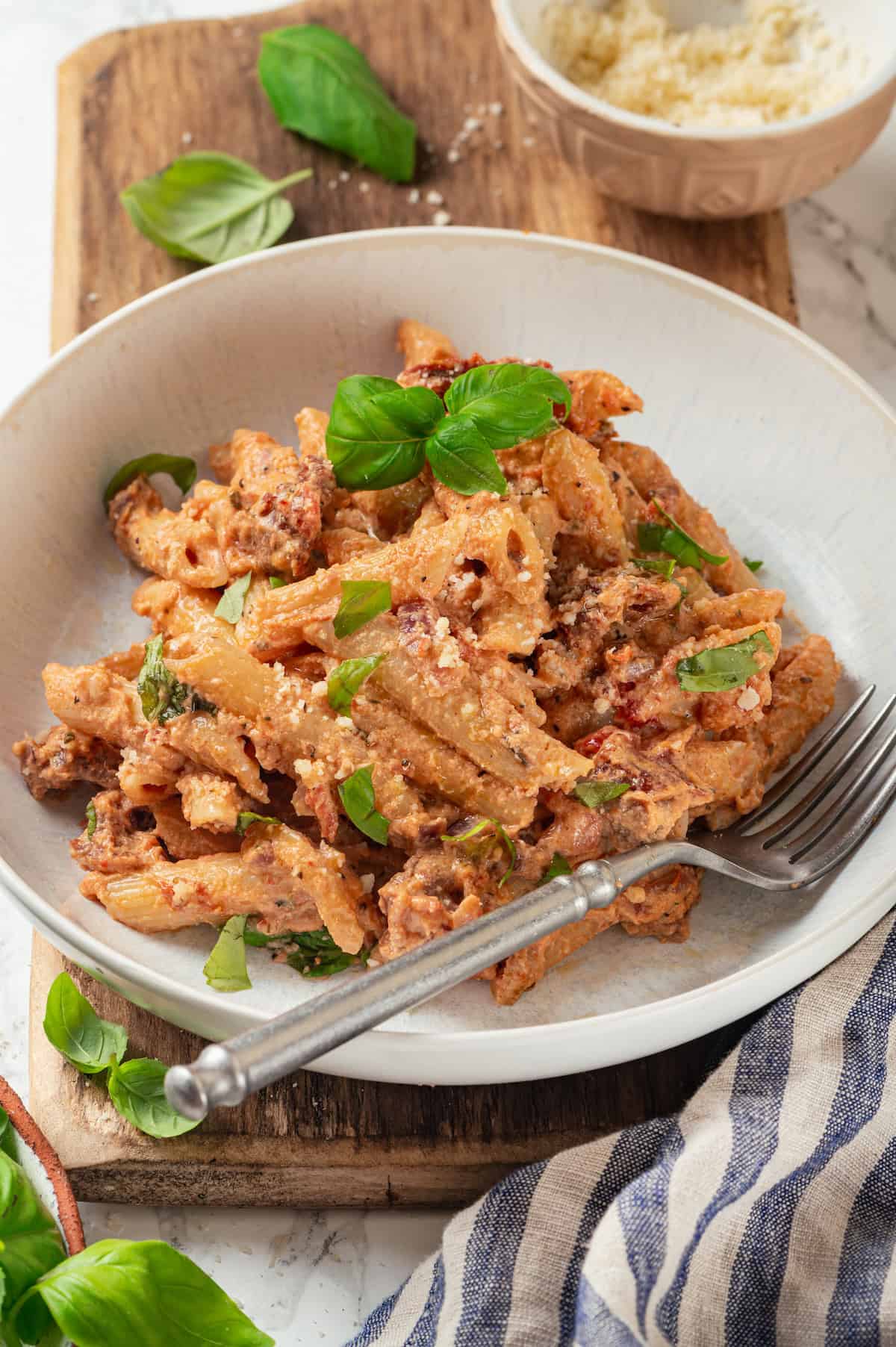 Creamy marry me pasta in bowl with fork