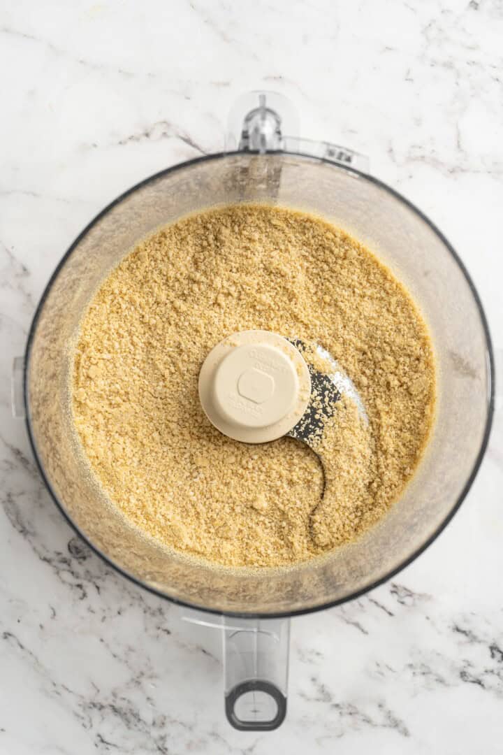 Overhead view of vegan Parmesan cheese in food processor