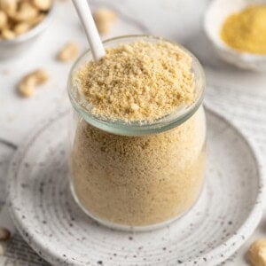 Jar of vegan Parmesan cheese with spoon