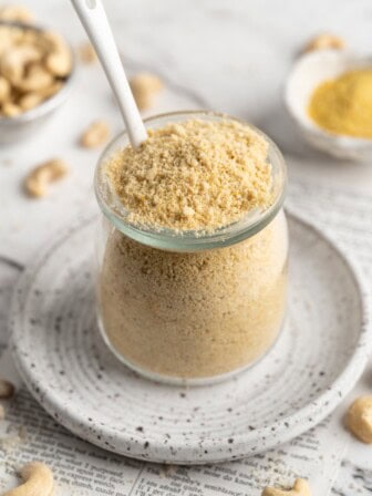 Jar of vegan Parmesan cheese with spoon