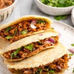3 gorditas piled onto plate