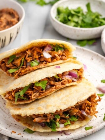 3 gorditas piled onto plate