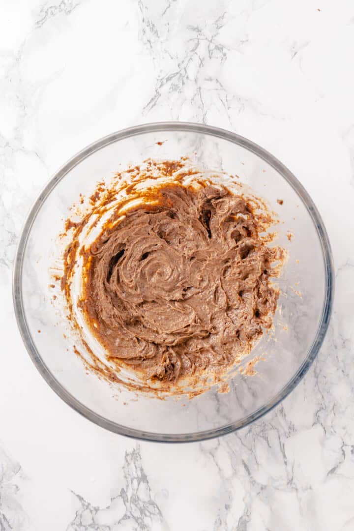 Overhead view of spiced butter in mixing bowl