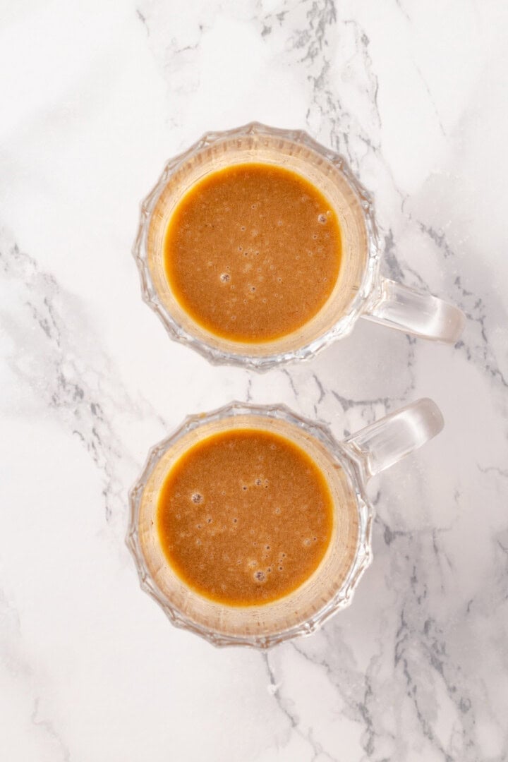 Overhead view of rum and batter in glass mugs