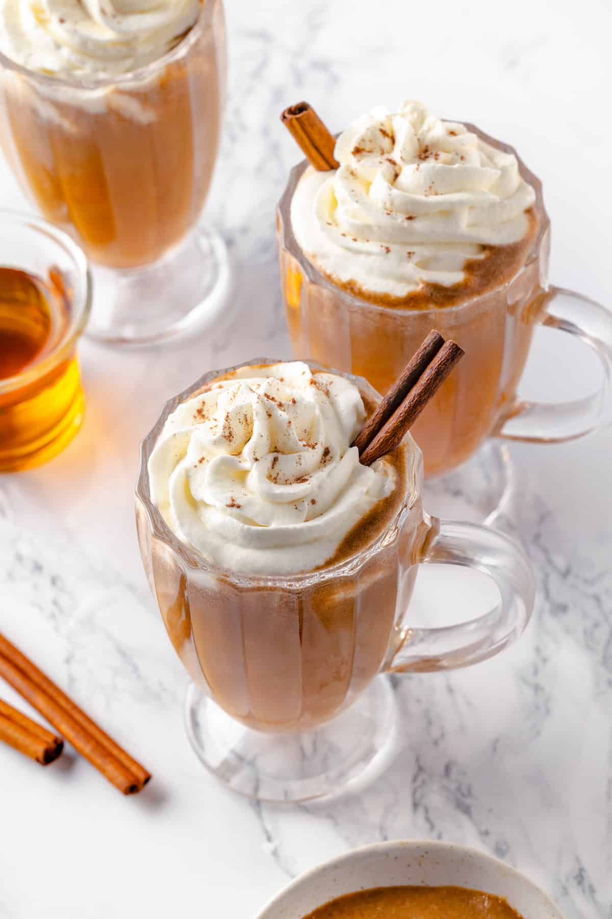 3 glass mugs of vegan hot buttered rum