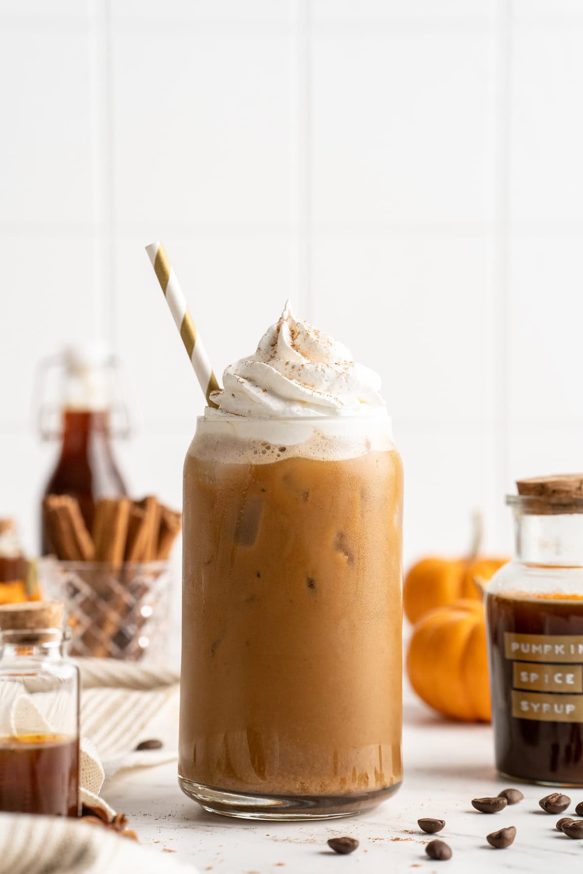 Homemade pumpkin spice latte with straw