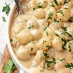 Overhead view of vegan creamed onions with spoon