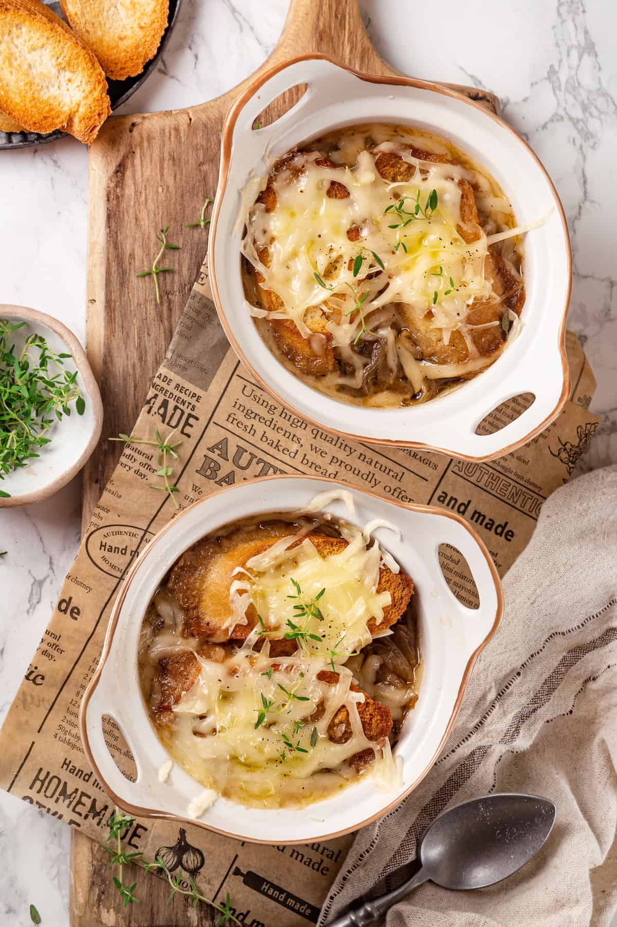 Overhead view of French onion soup in two bowls