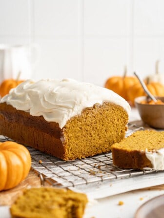 Loaf of pumpkin bread with cream cheese frosting