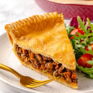 Slice of vegan tourtière on plate