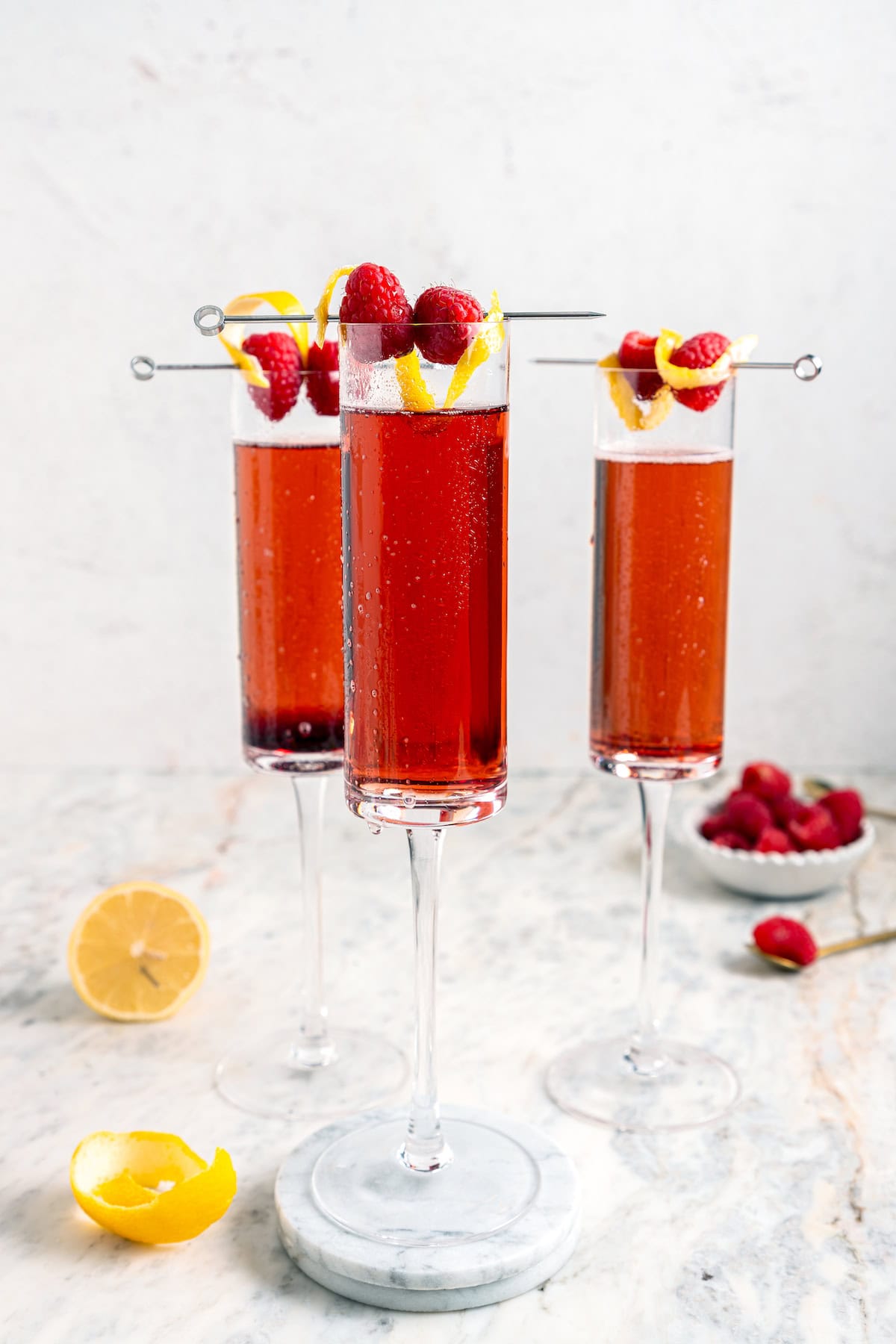 Kir royale cocktails in 3 champagne flutes