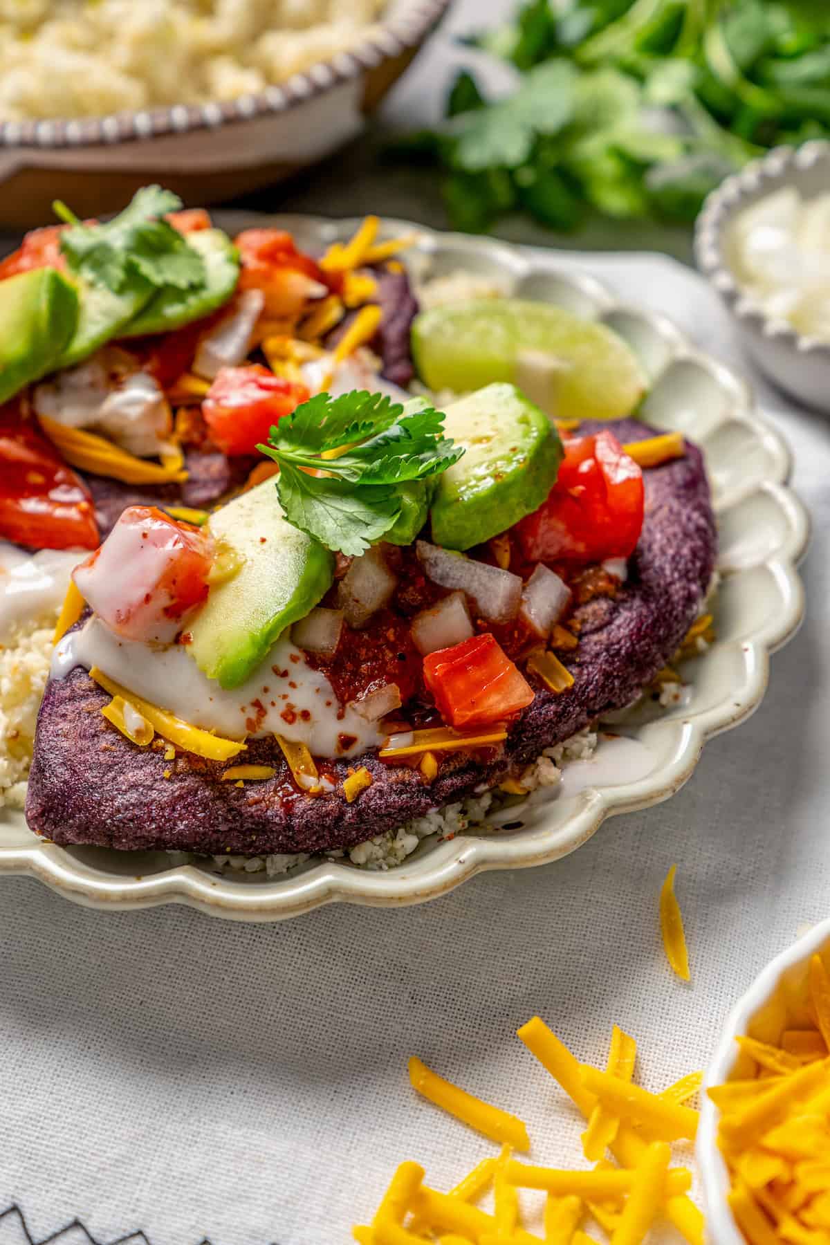 Tlacoyo on a plate with toppings.