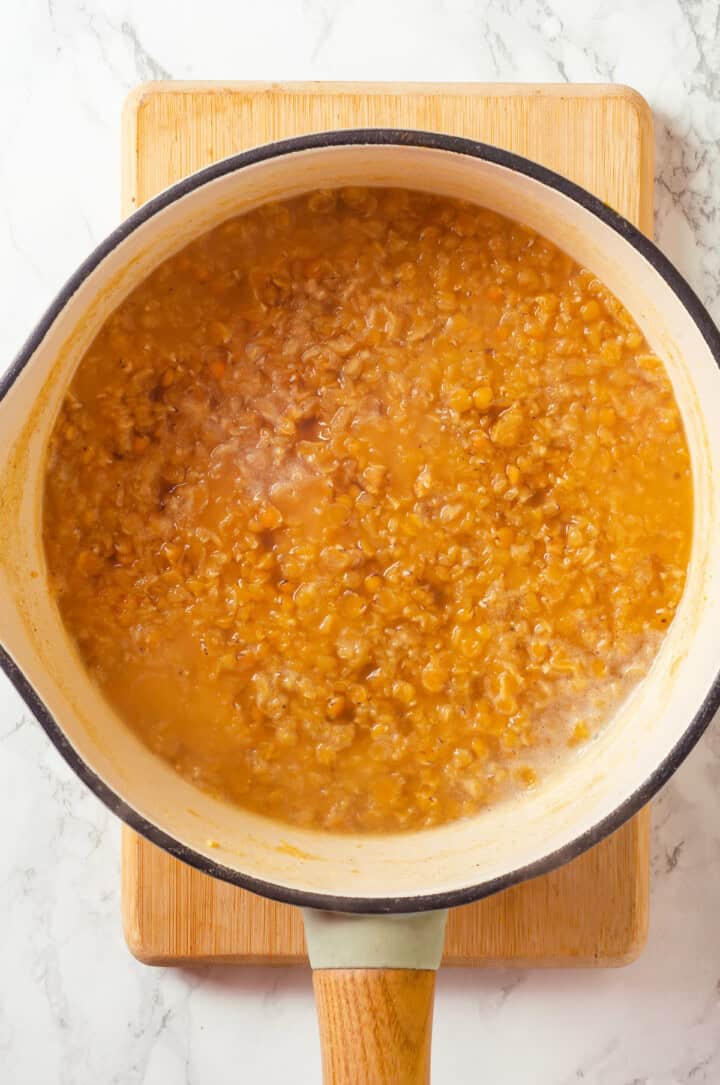 Cooked red lentils in pot