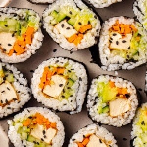 Vegan sushi with tofu, cucumber, carrot, and avocado