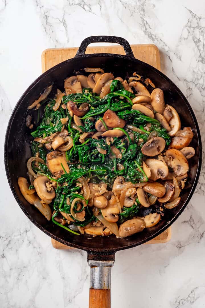 Sauteed spinach and mushrooms in skillet