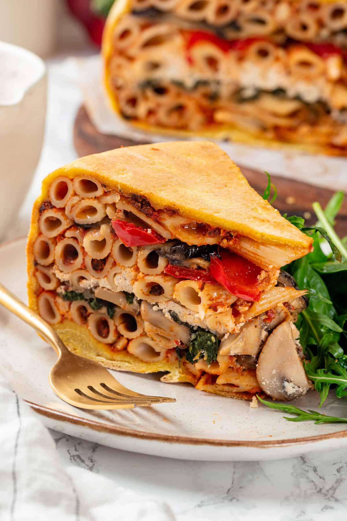 Closeup of vegan timpano slice on plate