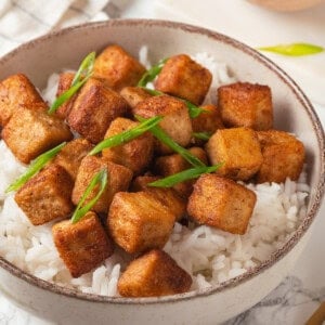 Crispy fried tofu in bowl of rice