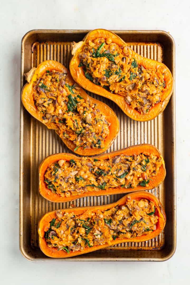 Stuffed butternut squash before adding vegan parmesan