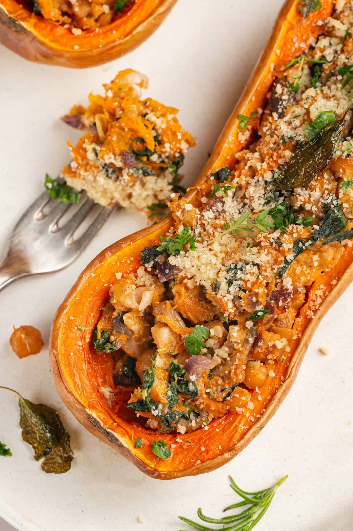 Stuffed butternut squash next to forkful of filling