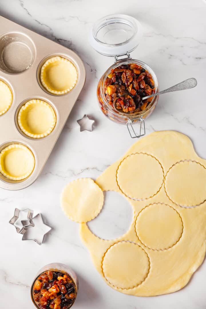 Overhead view of crusts being cut for mince pies