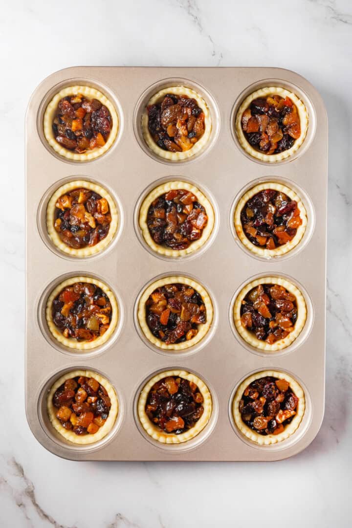 Overhead view of mince pies before adding top crust